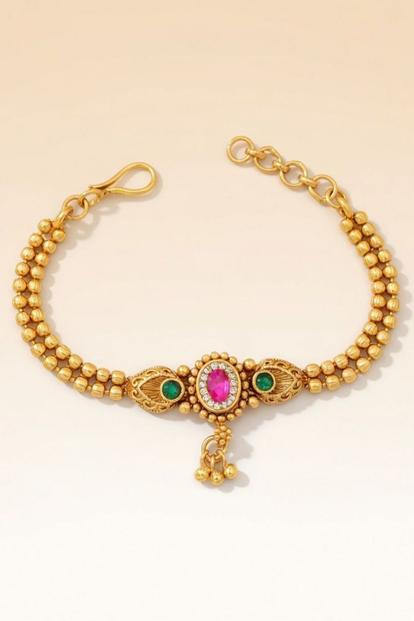 Metallic Traditional Brass Bracelet With Pink Stone Centerpiece