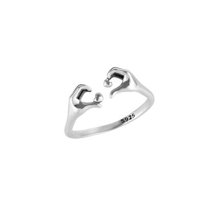 Metallic Heart With Hands Ring In Sterling Silver