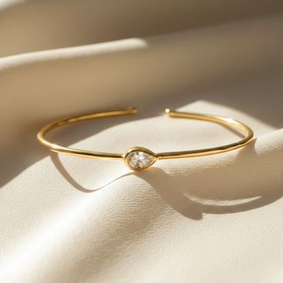 Metallic 18Ct Gold Plated White Topaz April Birthstone Bangle
