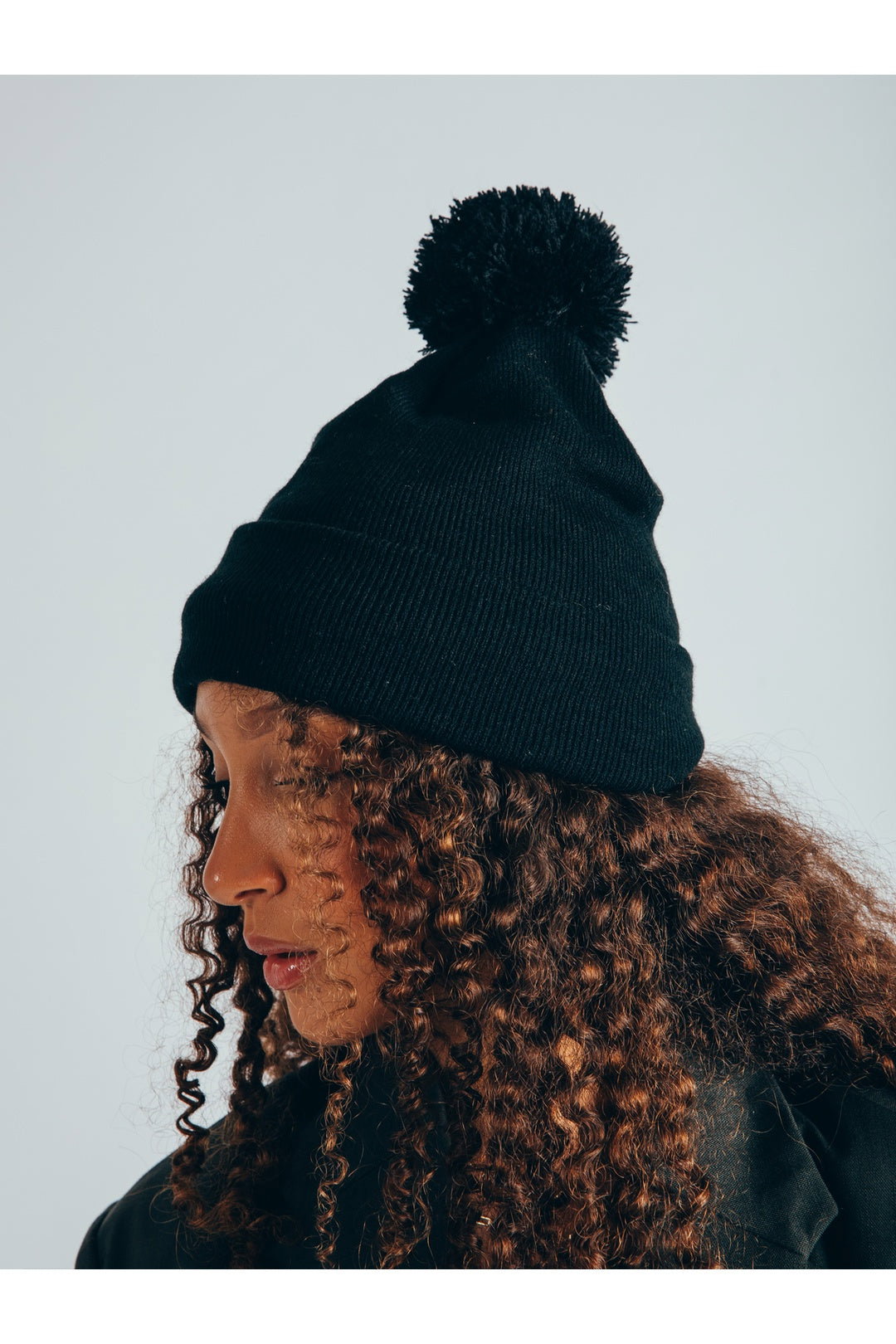 Dark Grey Knitted Pom Pom Beanie in Black, Image 2 of 7