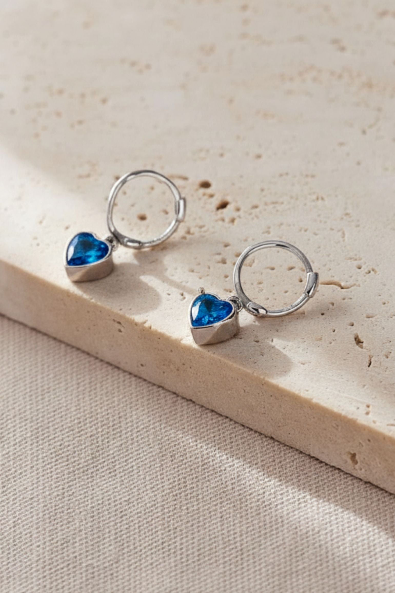 Blue Sterling Silver CZ Heart Huggie Hoops, Image 1 of 2