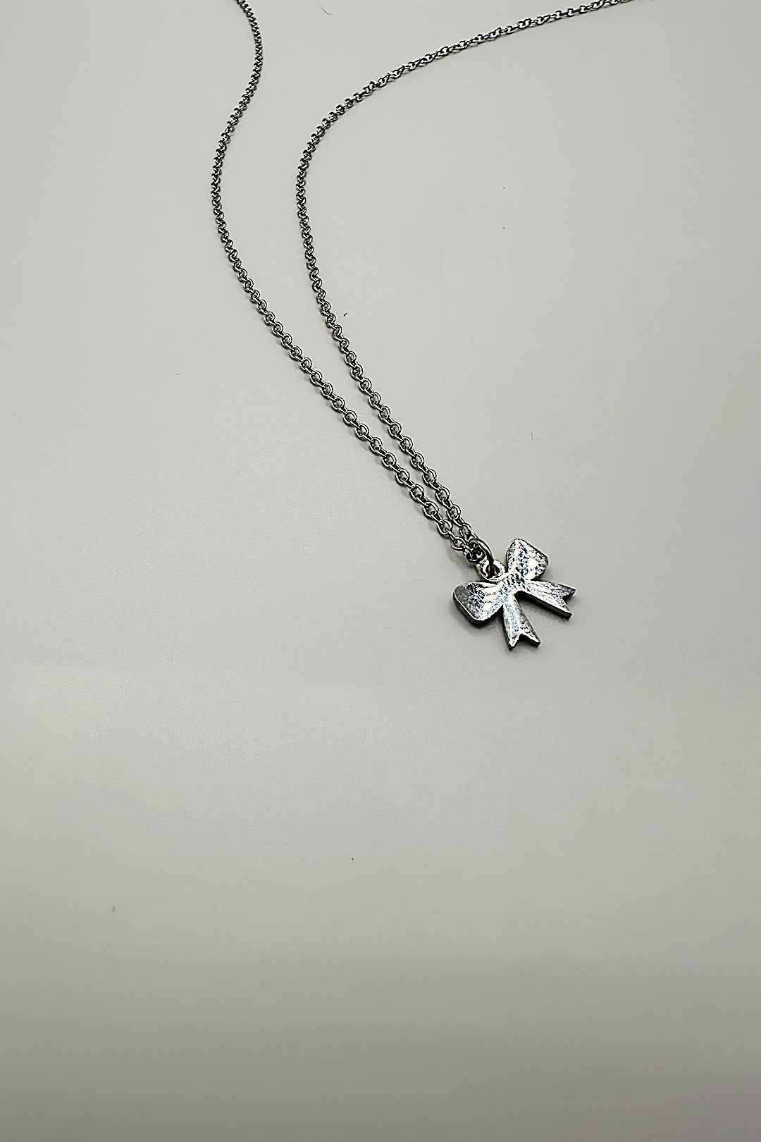 Silver Mini Bow Pendant Necklace in Silver, Image 3 of 3