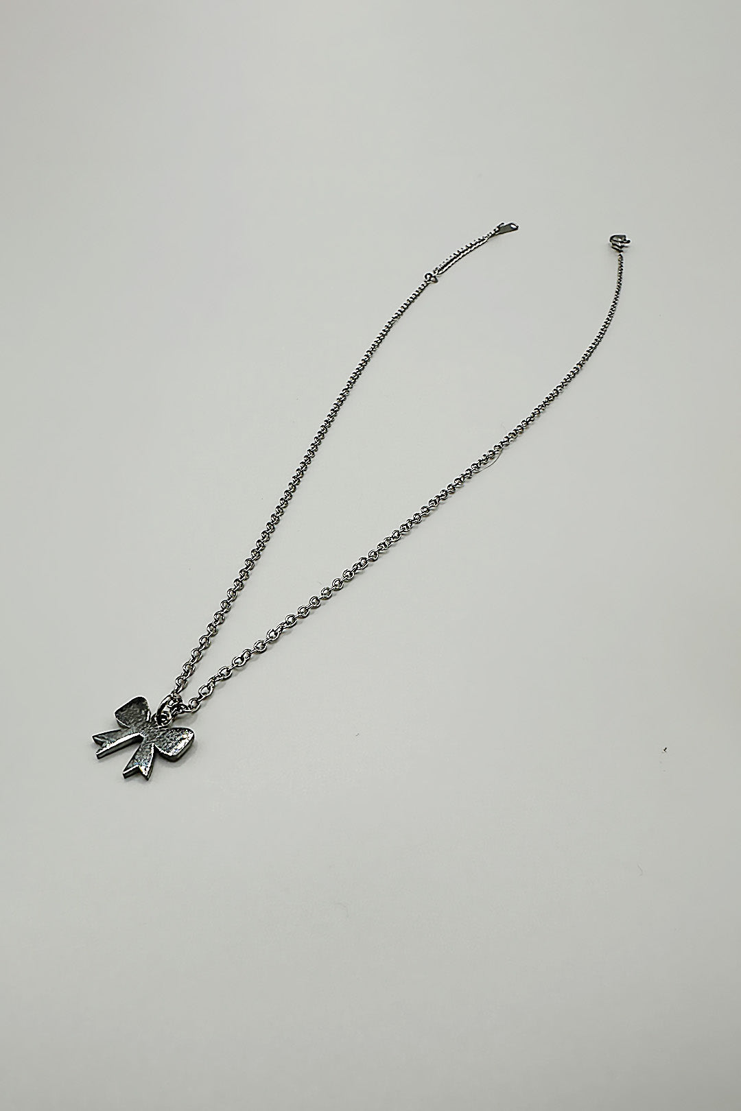 Silver Mini Bow Pendant Necklace in Silver, Image 1 of 3