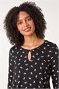 Black Bow Print Cutout Tunic Top, Image 1 of 5