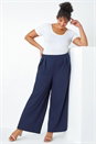 Navy Curve Wide Leg Pleat Elastic Waist Trousers, Image 1 of 5